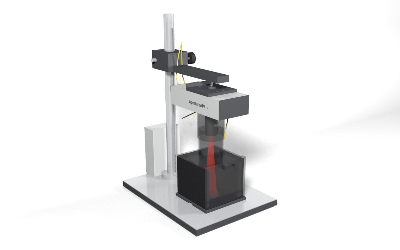 CAD render (design values) of the bench surface profiler: a sealed reflection head on a short rigid stand above a 150 x 150 mm sample stage, with a four-sided light shroud, lift-off front door, lid and telescoping light sleeve around the measurement zone and an electronics pod at the rear; front door, lid and light sleeve shown translucent for illustration; the laser is off whenever the door is open.